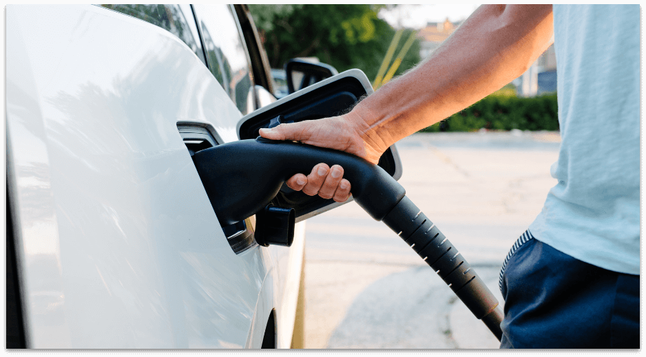 Person charging electrical vehicle