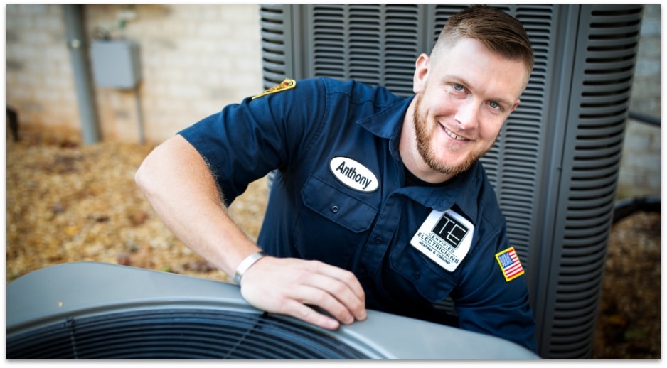 Smiling technician with hvav condensor