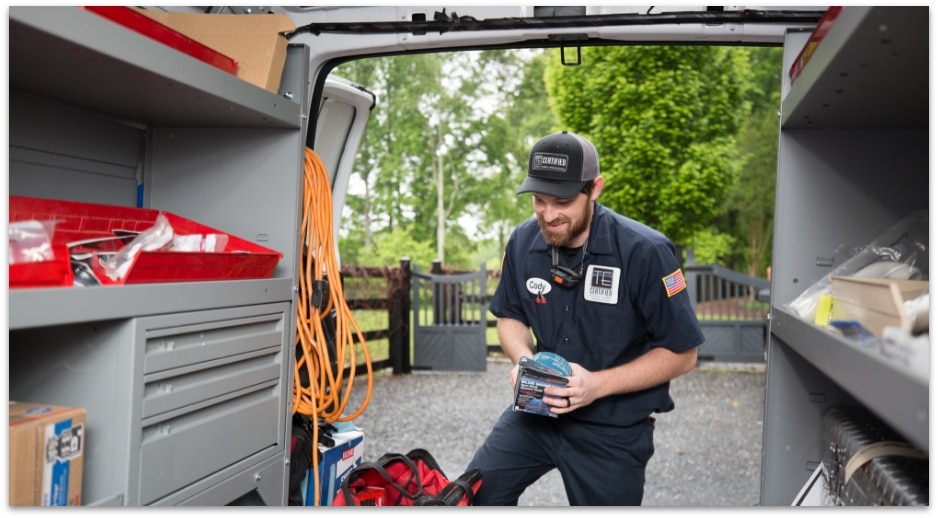 Te certified technician in back of van