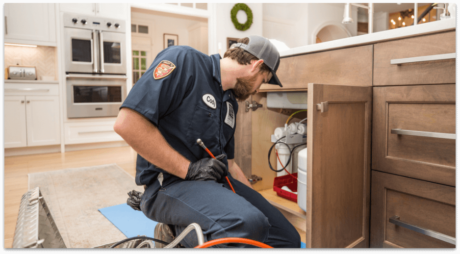 Technician installing new plumbing