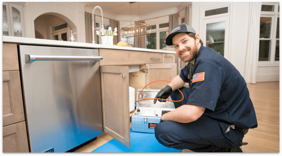 Technician performing plumbing inspection